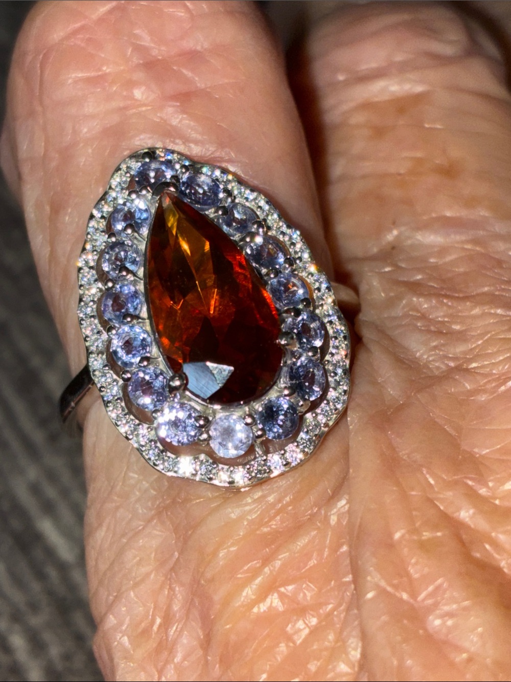 Red Citrine, Tanzanite and Moissanite set in silver with rhodium plating size 8